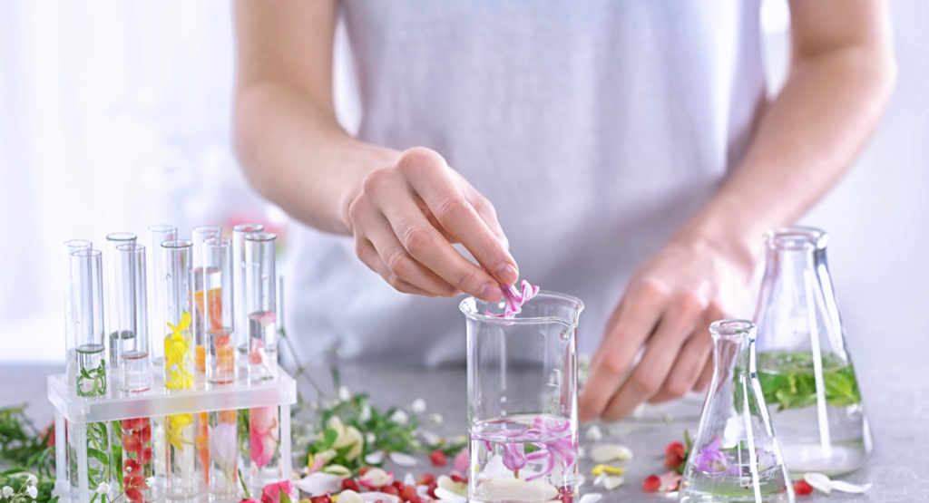women making flower essences in beakers