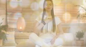 Girl with hand on chest giving reiki to self