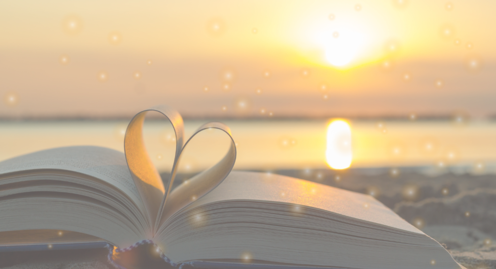 open book at sunset on beach with heart shaped on page